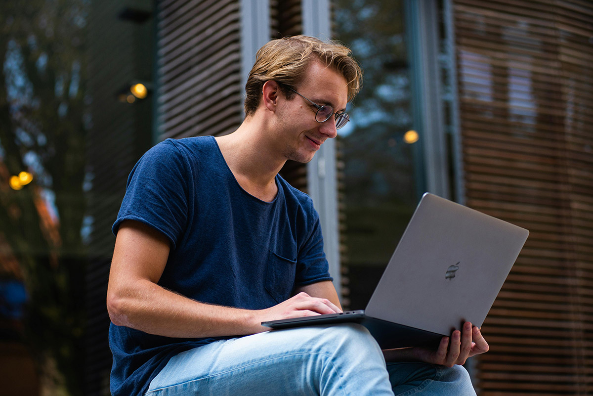 man using business directories on his laptop